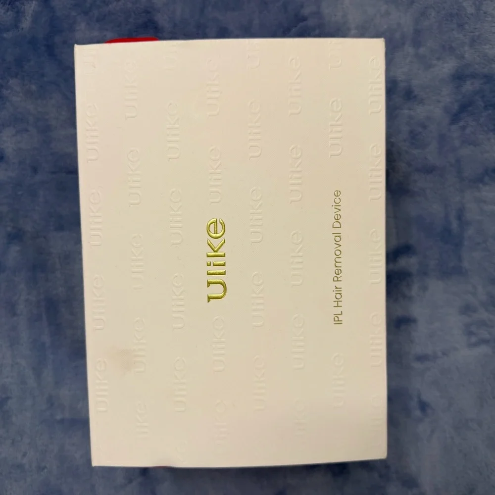 Ulike hair removal White Handheld Device in Original Box used 1 time‎